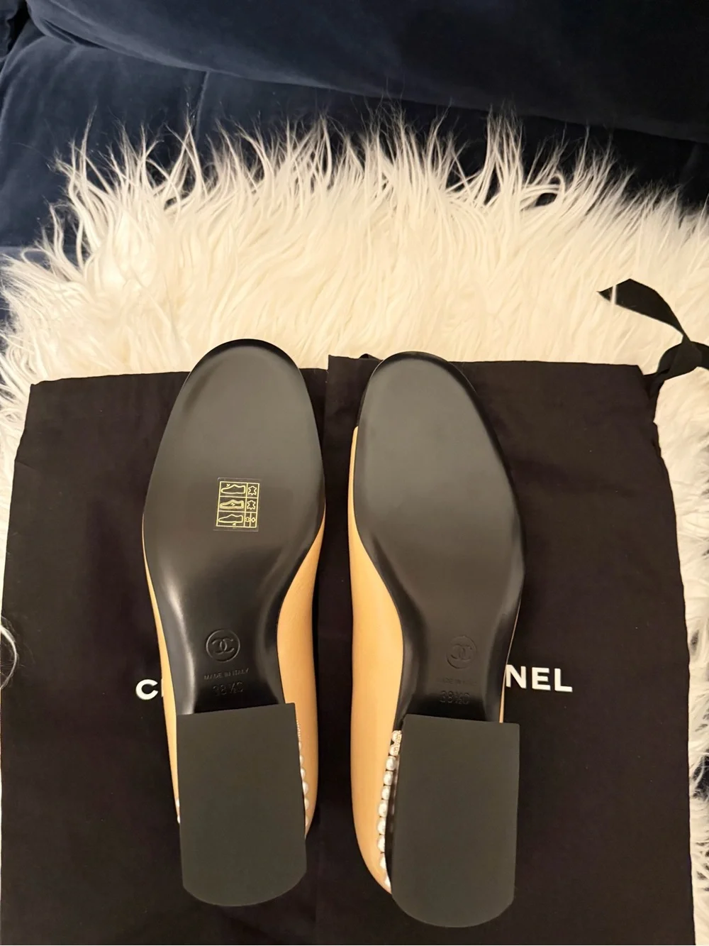 CHANEL Tan Leather Ballet Flats with Black Cap Toe and Pearl Heel Trim
